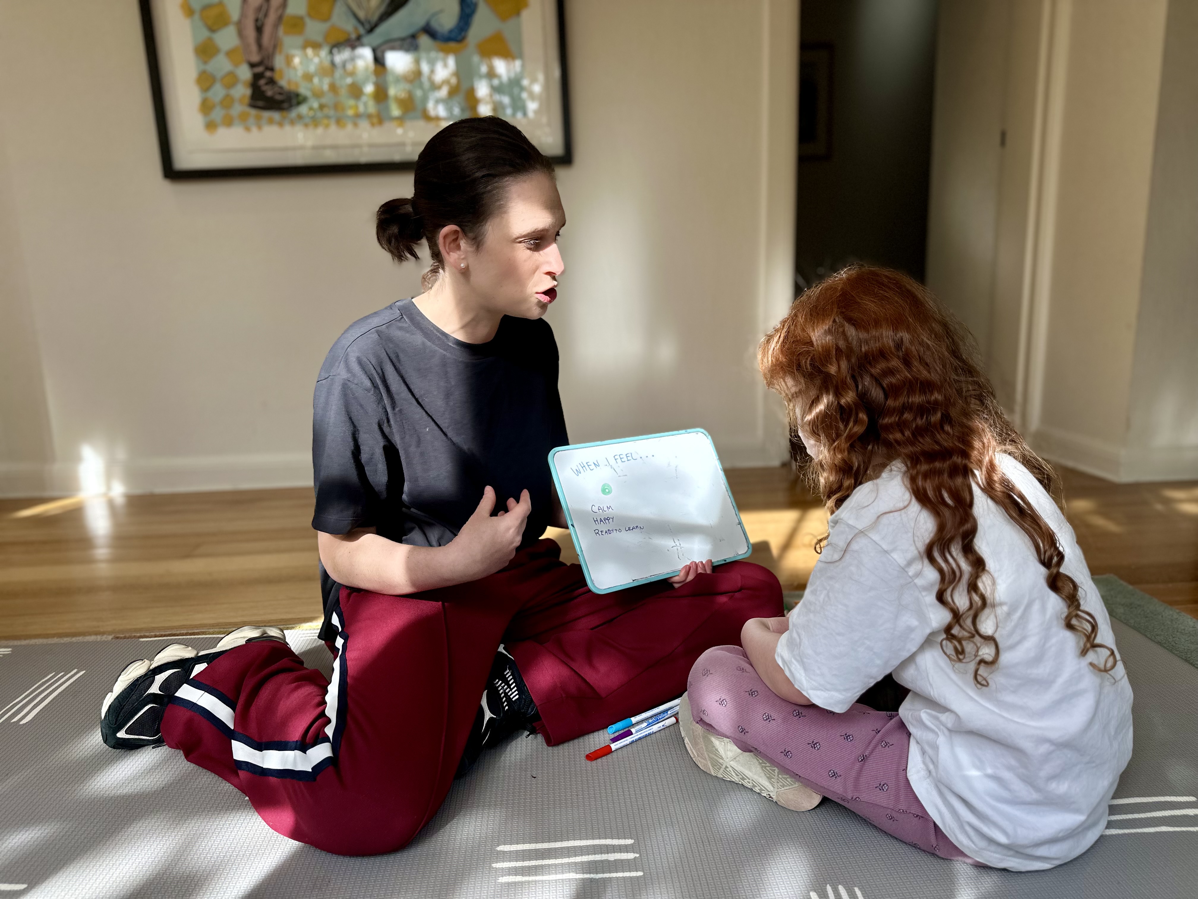 Deli working with a child on emotional regulation