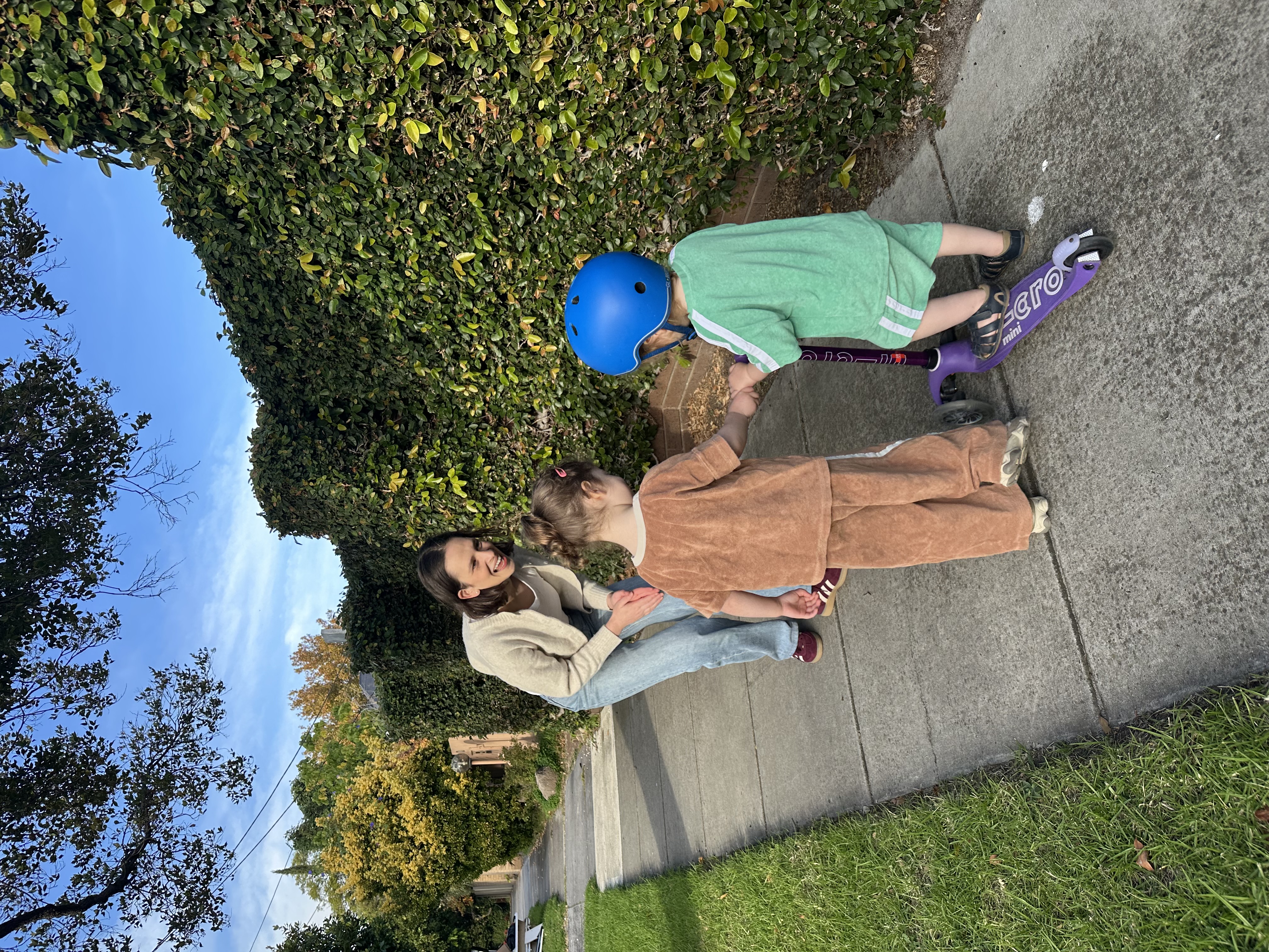 Children sharing a scooter together