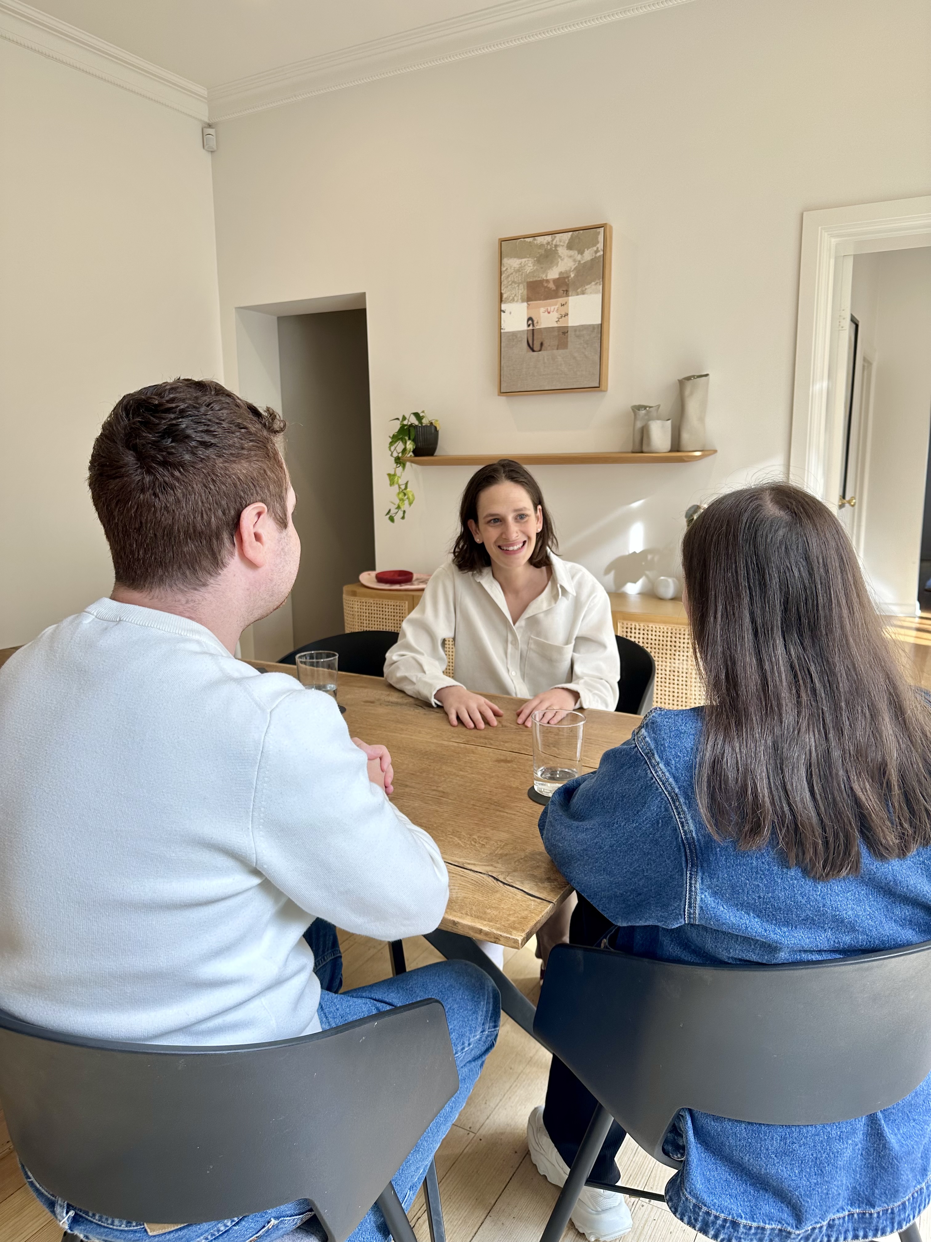 Deli working collaboratively with a family